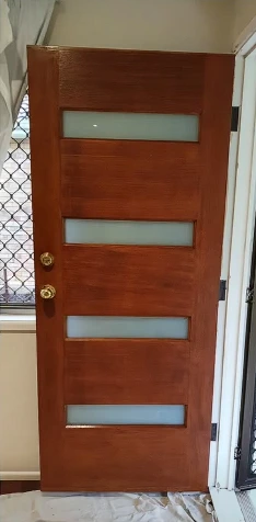 Front door after: rich red-brown stain