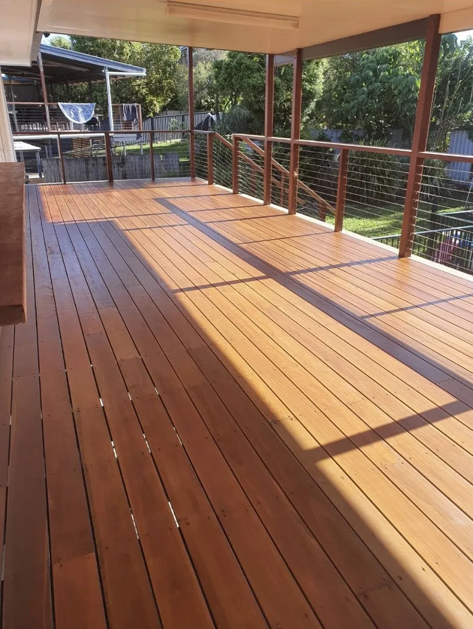 Covered timber deck after: stained a warm golden brown