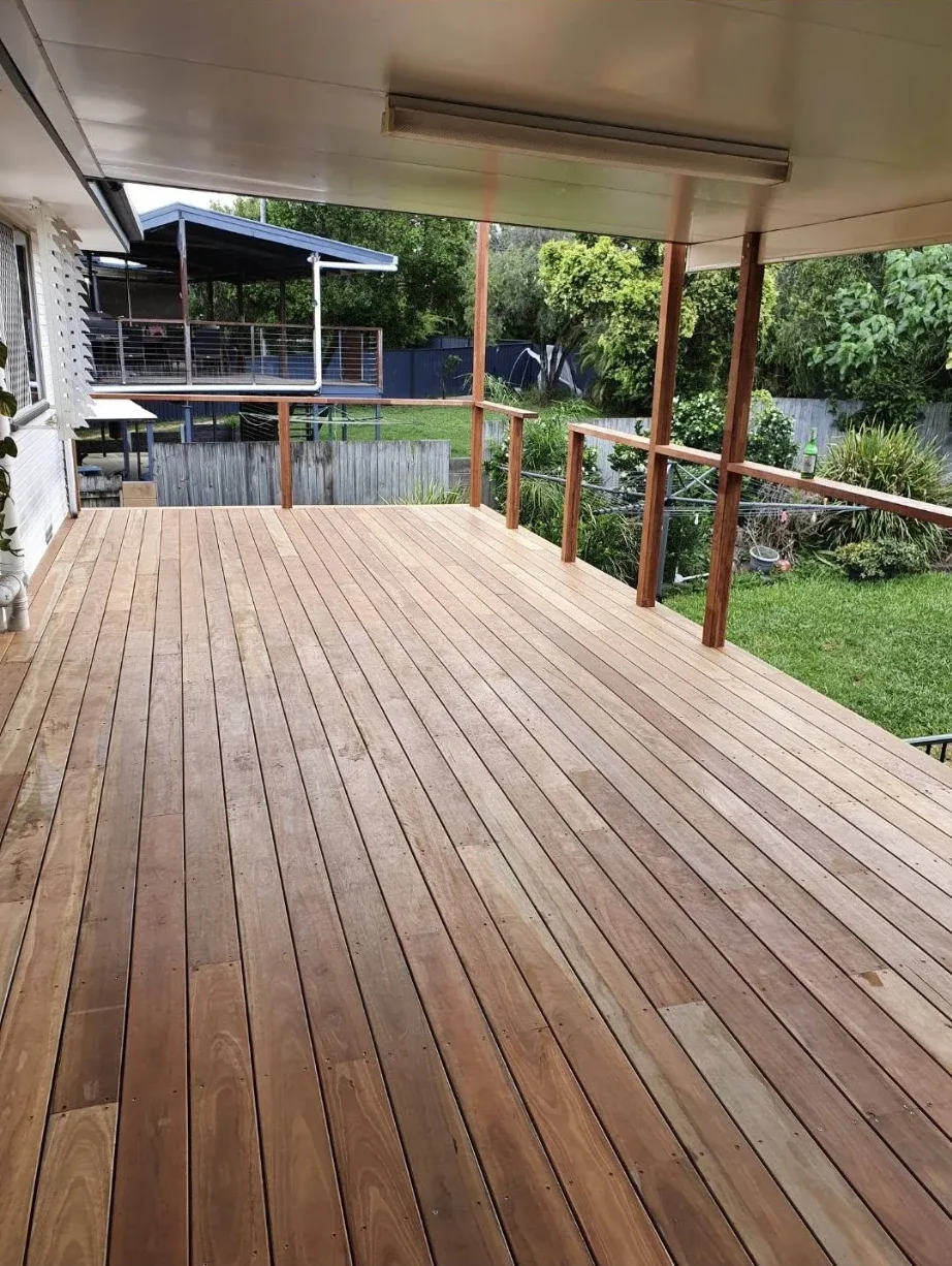 Covered timber deck before: raw, unfinished boards